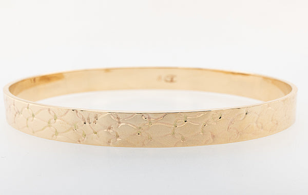 Embossed Solid Bangle Oval Shape 22.72grams.
