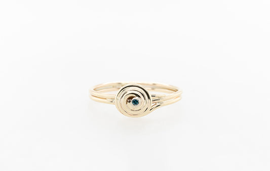 Gold Swirl Ring with Blue Diamond