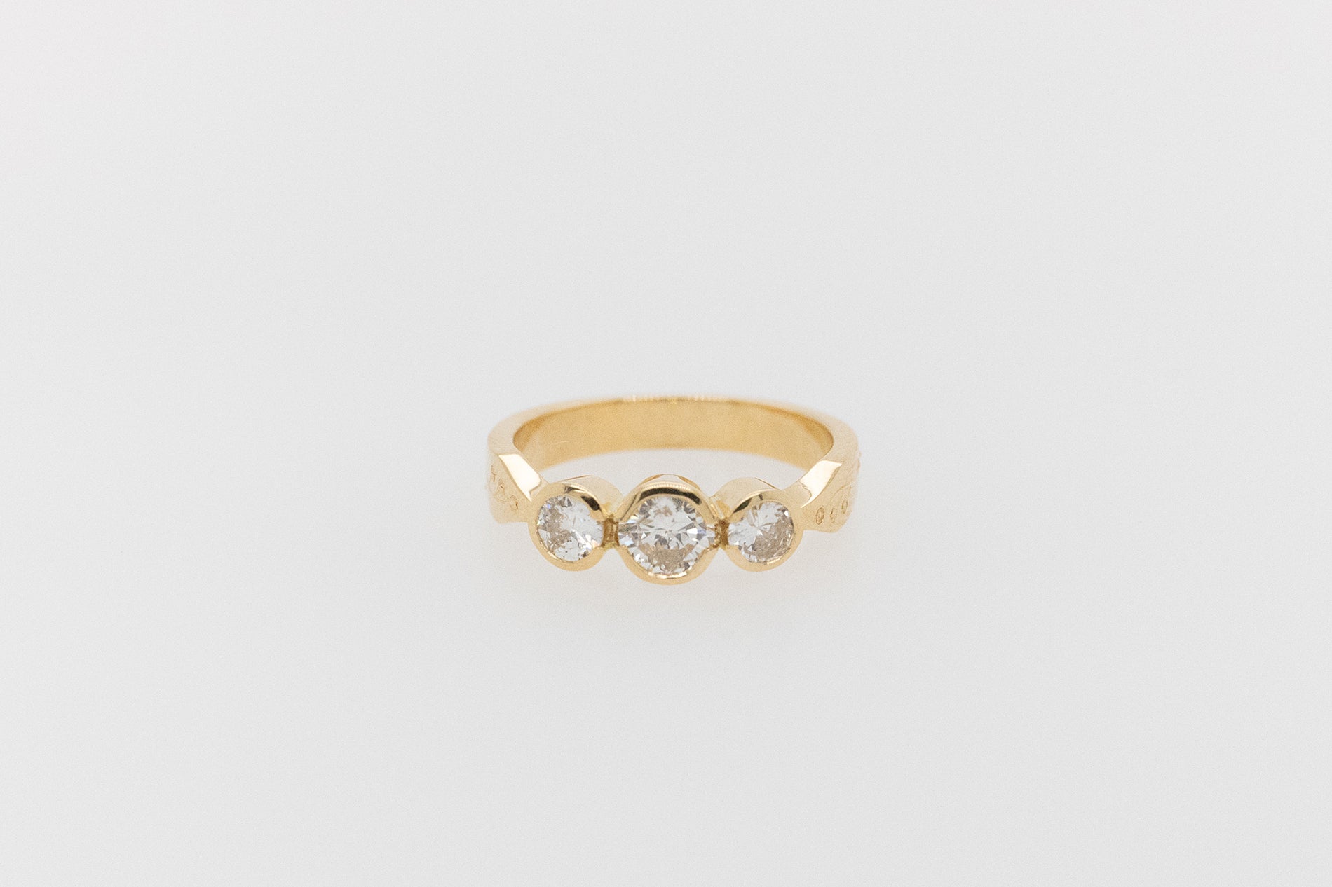 Trilogy Bezel Set Floral Engraved Engagement Ring