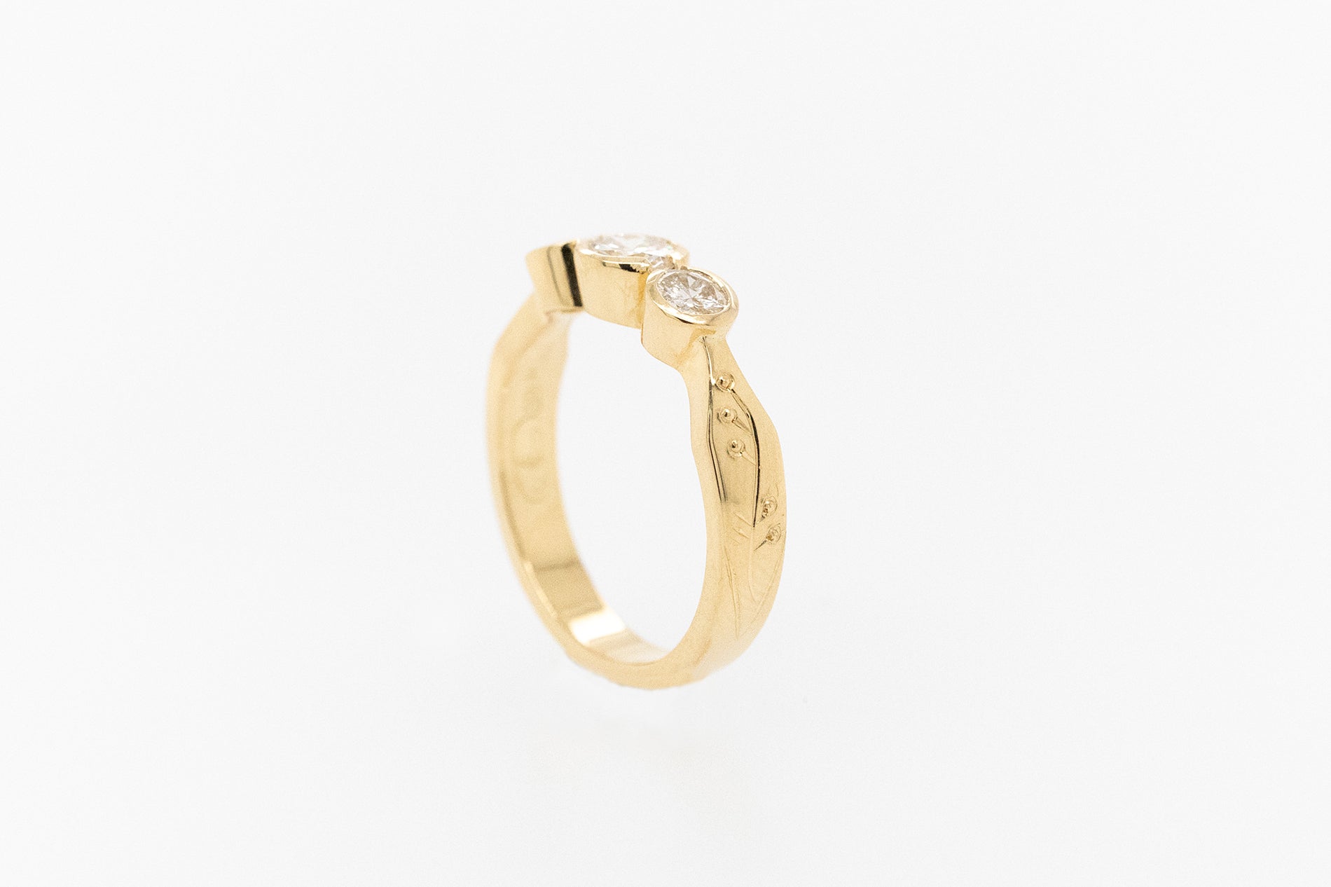 Trilogy Bezel Set Floral Engraved Engagement Ring